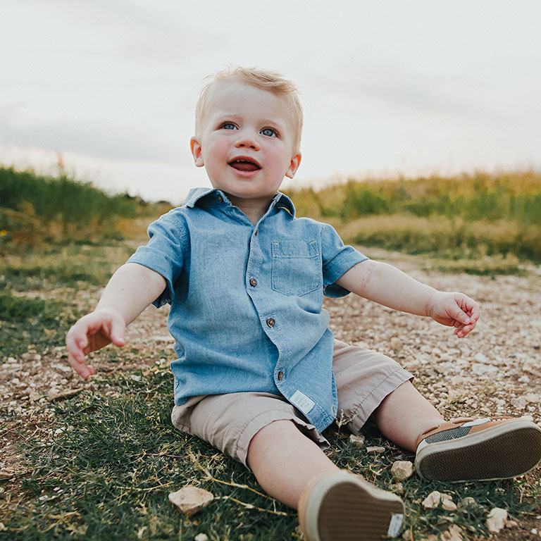 little boy reaching out