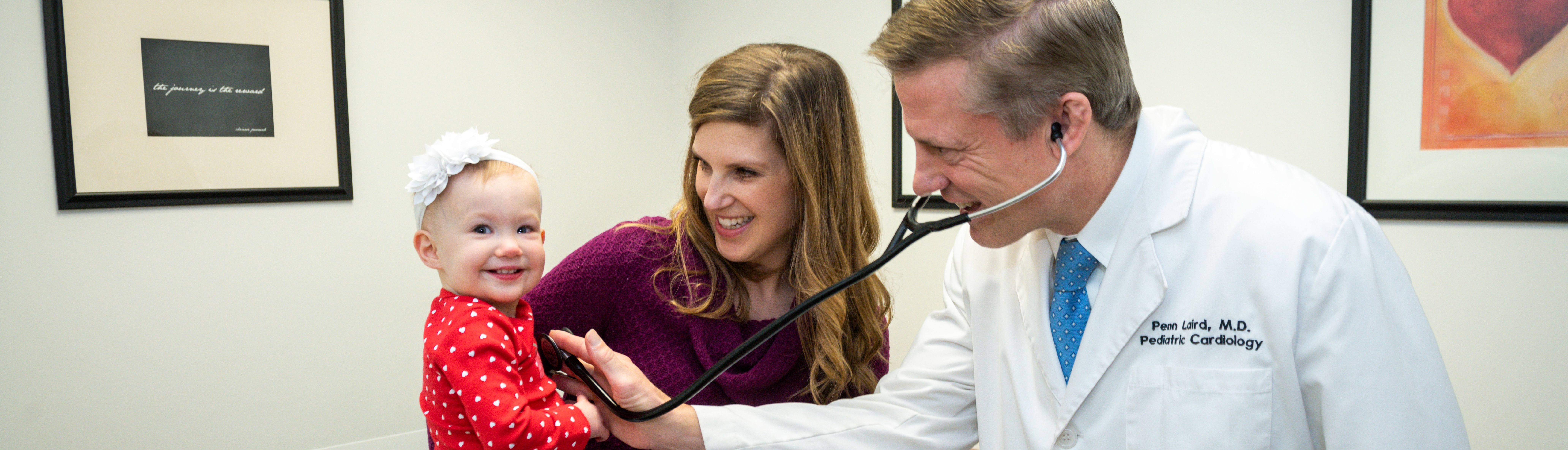 doctor checking out little girl
