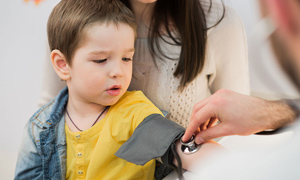 Boy getting blood pressure checked