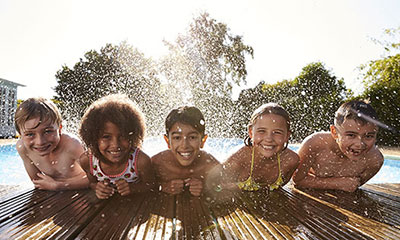 Kids smiling at the pool