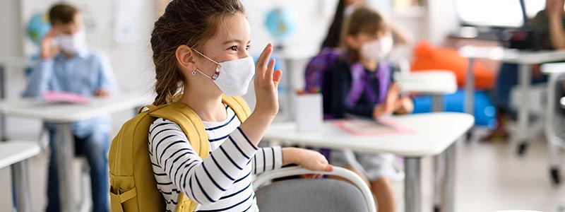 Teenagers headed back-to-school wearing their facemasks.