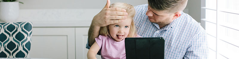 Father and daughter participating in a virtual visit