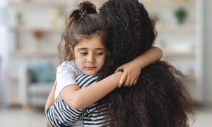 girl hugging mom